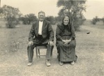 Couple sitting in field
