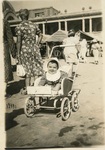 Toddler in stroller by Fernandez