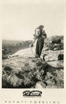 Woman sitting on rocks by Foto Mickey